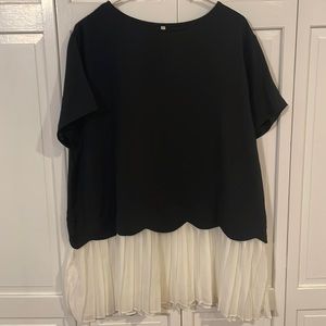 Blouse with pleated hem